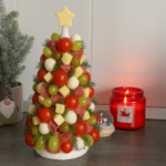 Festive Charcuterie Christmas Tree made with meats, cheeses, fruits, and rosemary.