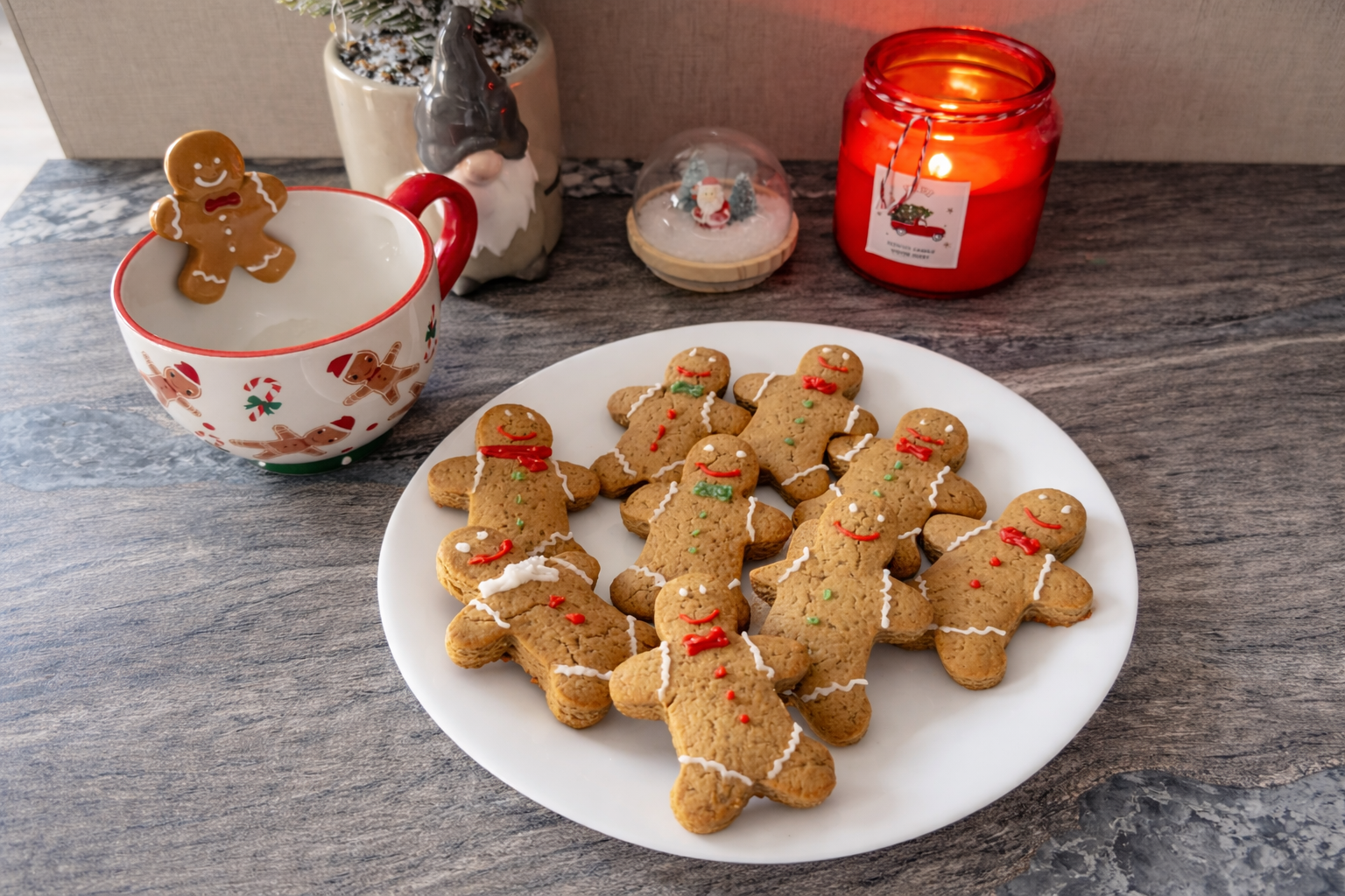 Homemade gingerbread man cookies with ginger and cinnamon on a festive Christmas plate